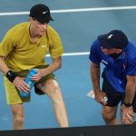 Cramping Jannik Sinner defeats American after roof is closed